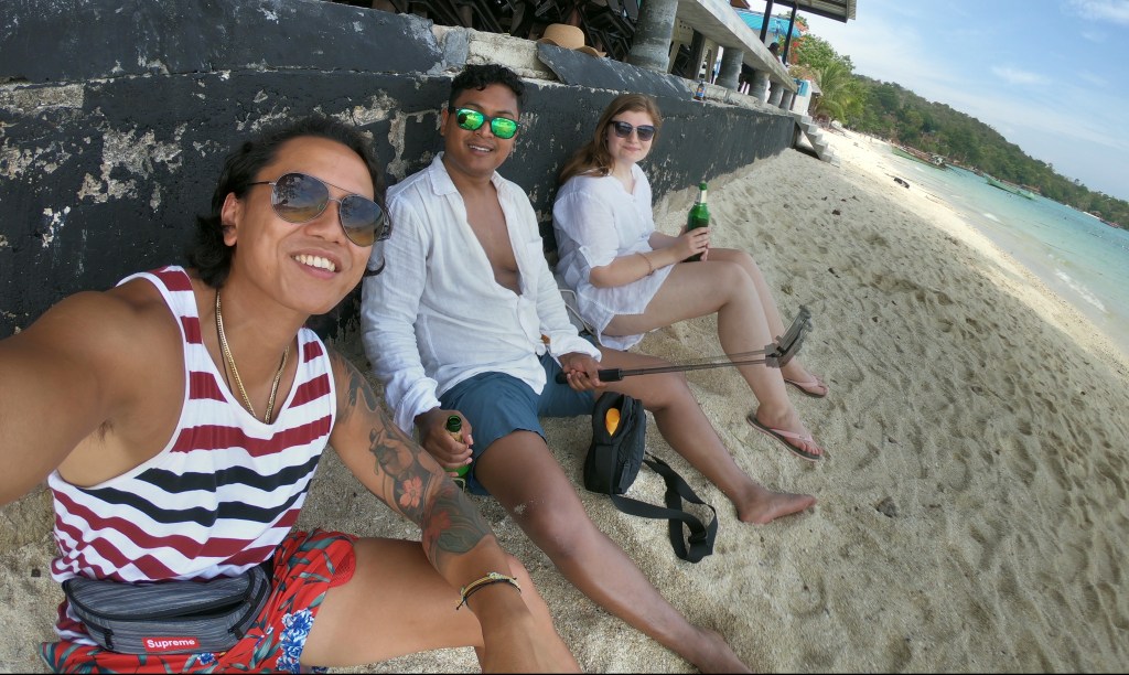 Day traveling through SE Asia > Having a beer on a beach in Koh Phi Phi, Thailand > TheRoamingNoodle